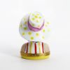 Picture of  Retired Limoges Porcelain Vacationing Lady Trinket Box with Surprise Palm Tree Inside. 