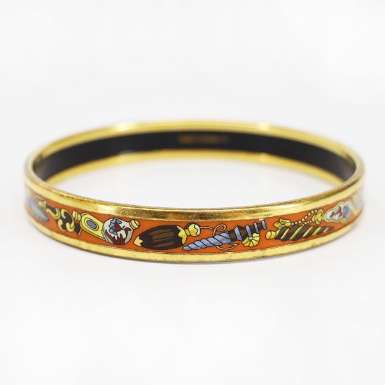 Picture of Vintage Hermès Orange Enameled Bangle Bracelet with Perfume Bottle Motif